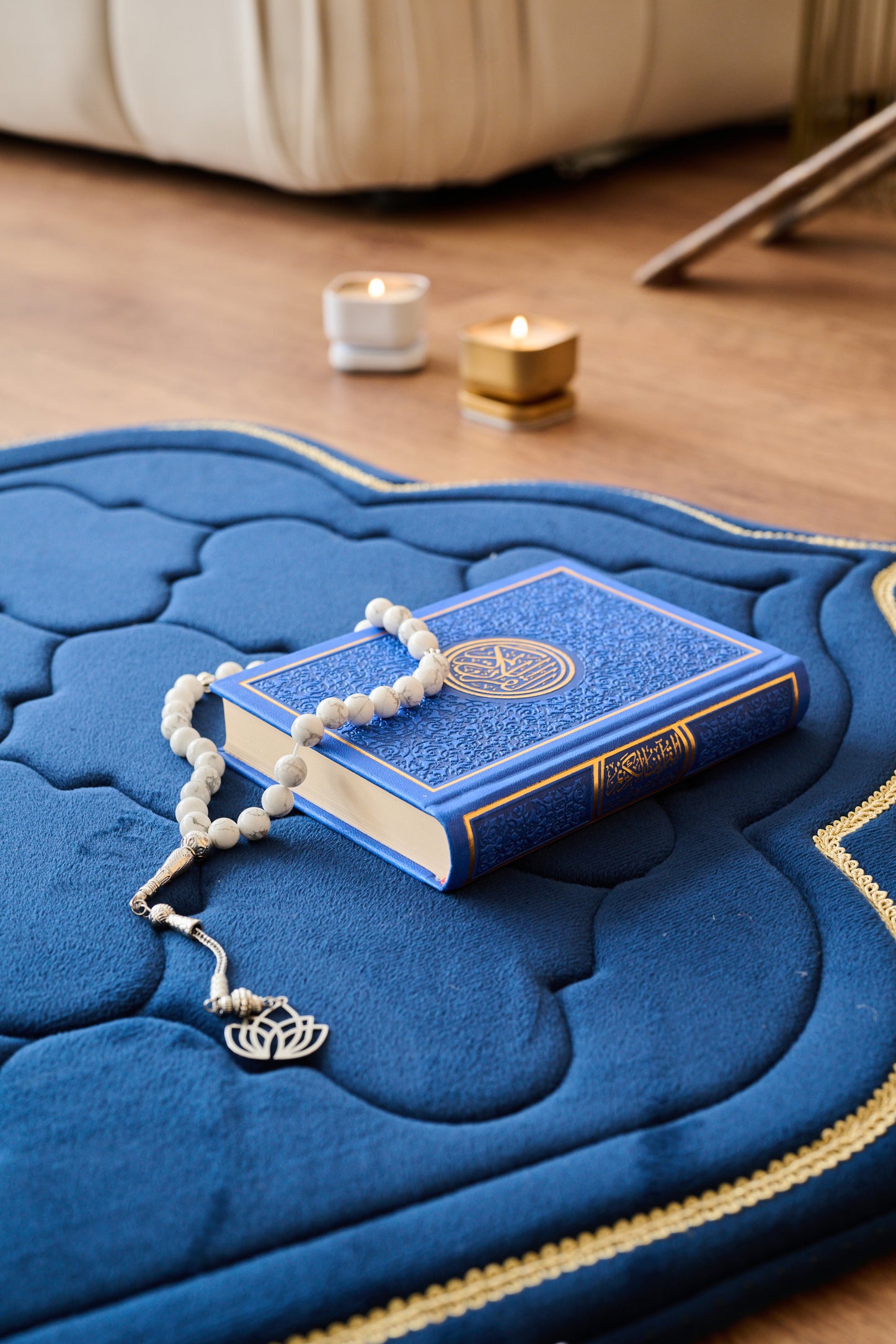 luxury thick padded foam prayer mat with a rosary, candles and Quran