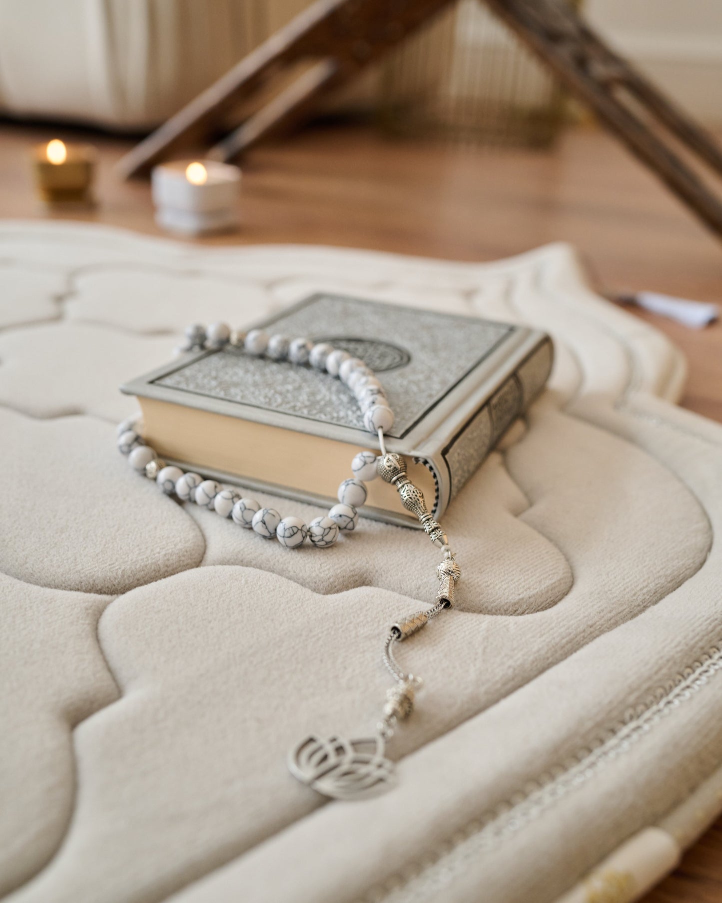 luxury thick padded foam prayer mat with a rosary, candles and Quran