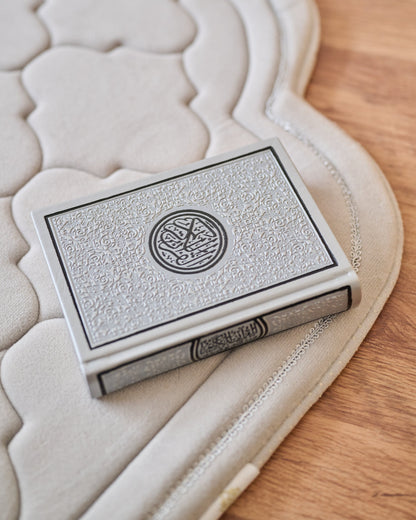 Decorative box with intricate design on a textured surface