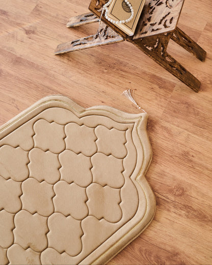 Decorative memory foam padded prayermat with geometric pattern on a wooden floor