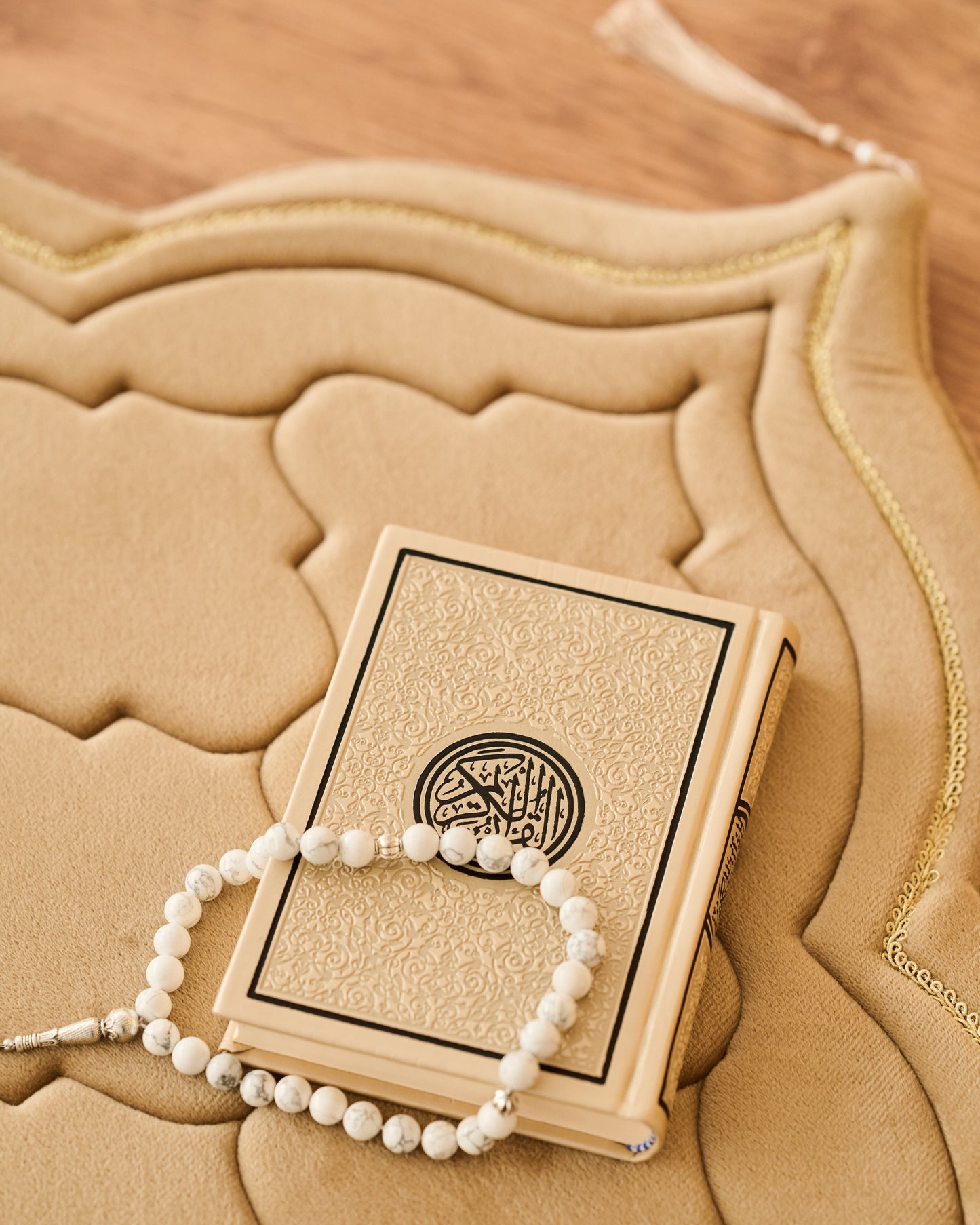 luxury thick padded foam prayer mat with a rosary, candles and Quran