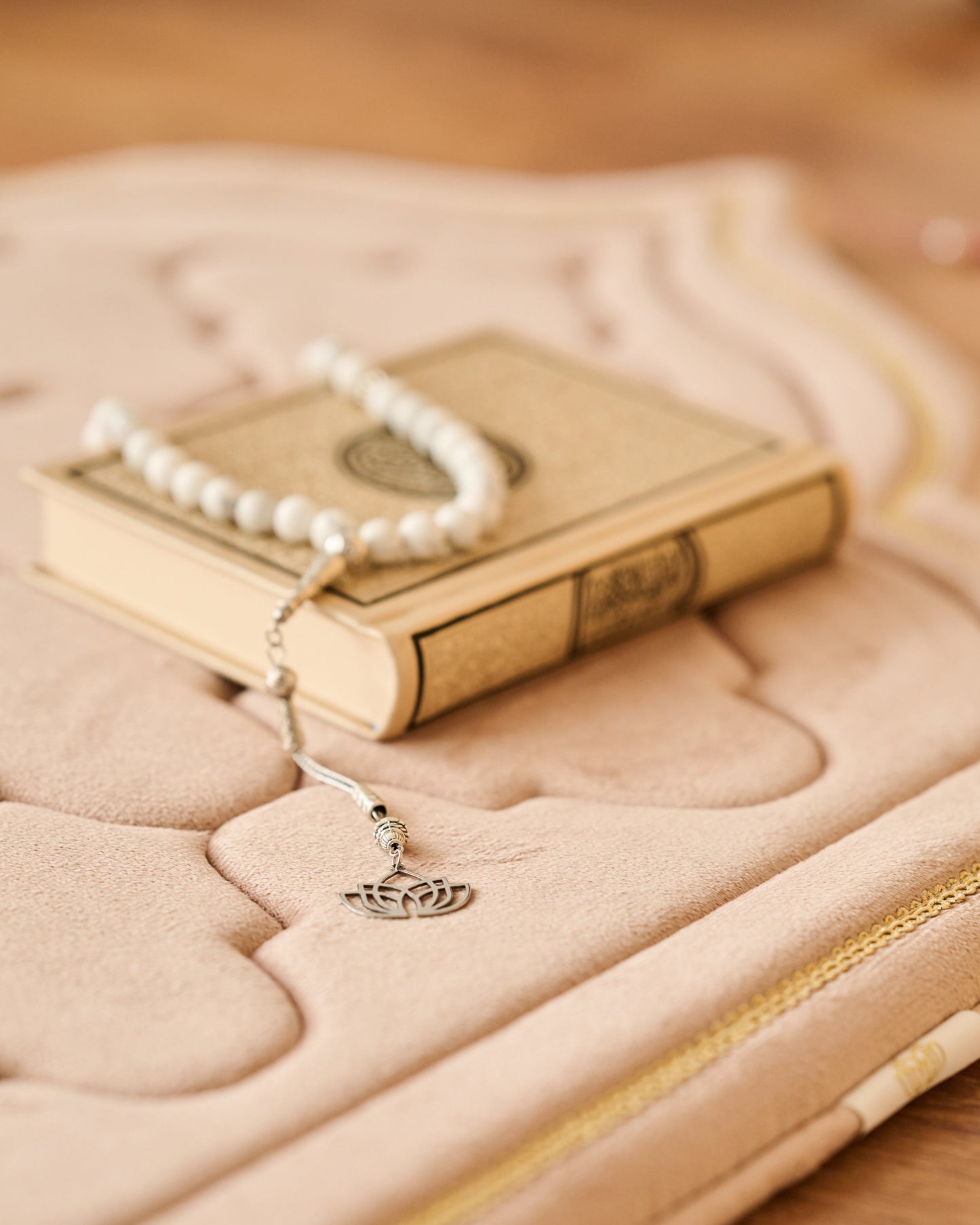 luxury thick padded foam prayer mat with a rosary, candles and Quran